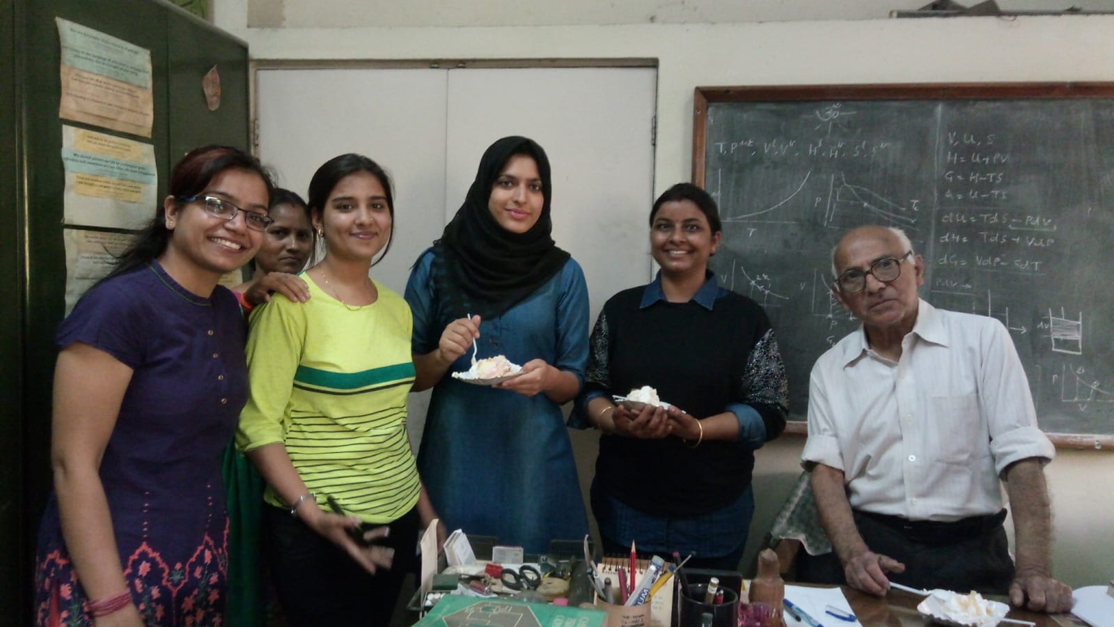 A birthday celebration in a thermodynamics classroom, with Prof. Gupta at his desk.