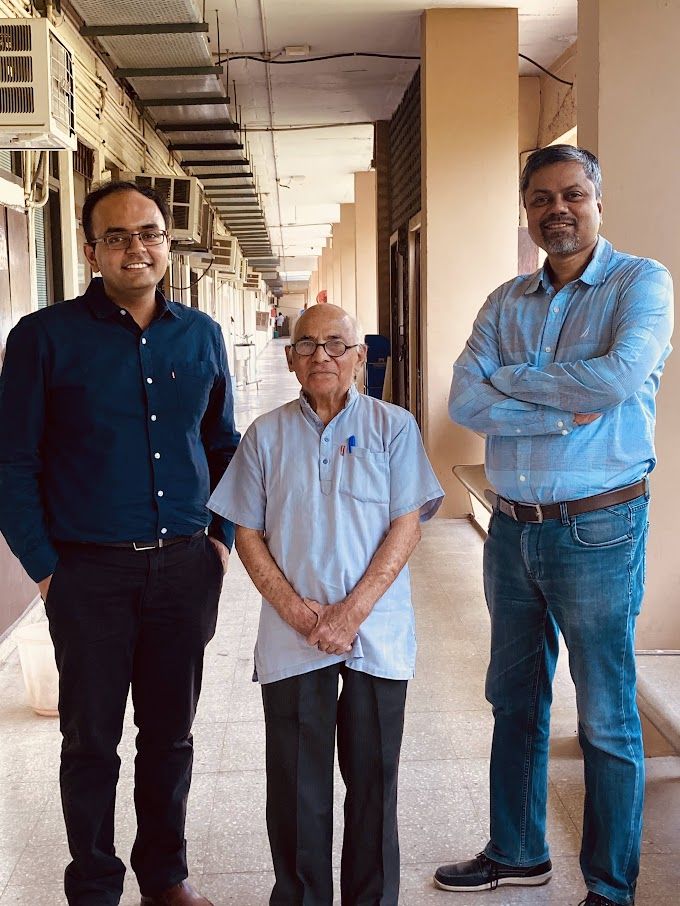 Prof. Gupta in the Chemical Engineering corridor at IIT Delhi, flanked by Ankur Gupta and Prof. Shantanu Roy.