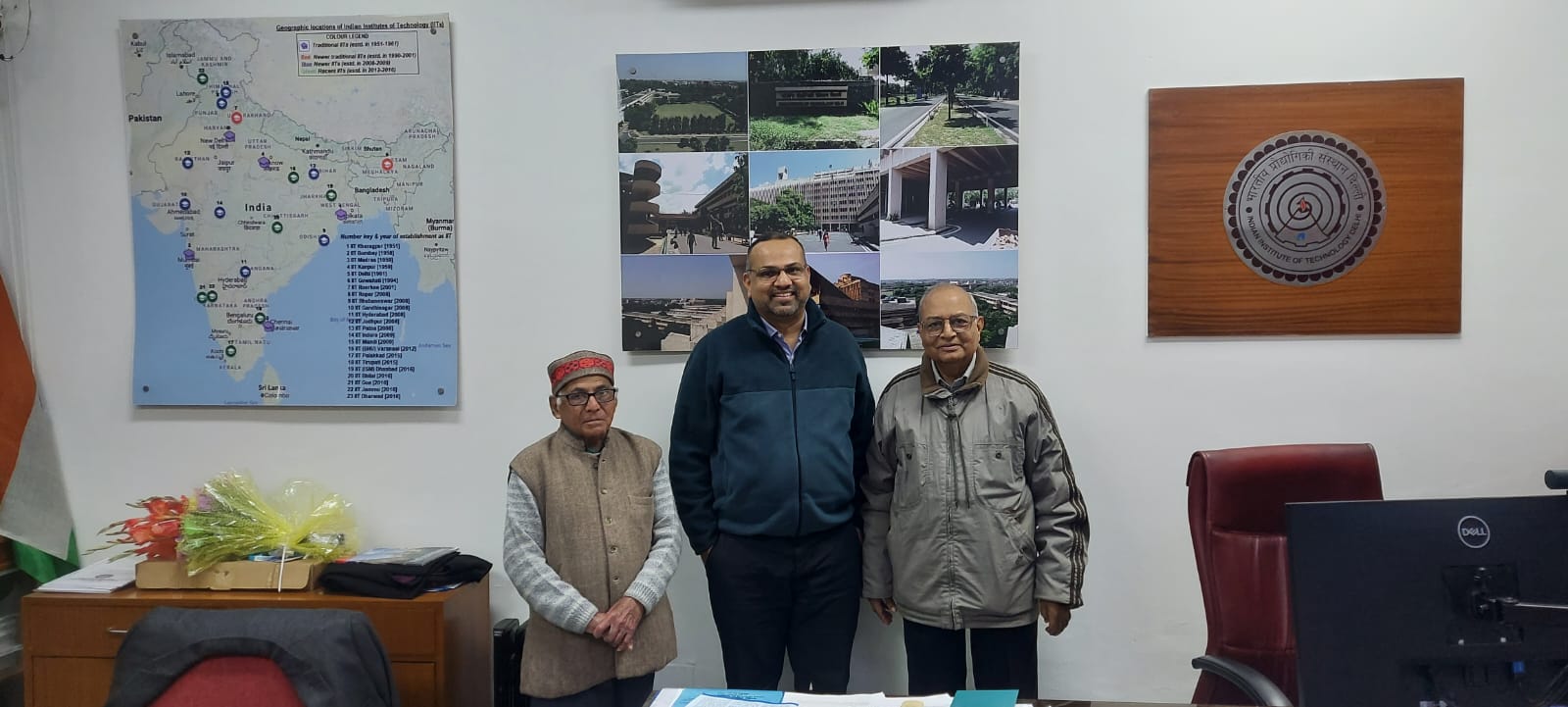 Prof. Gupta standing with Prof. Vivek Buwa and another colleague at IIT Delhi.