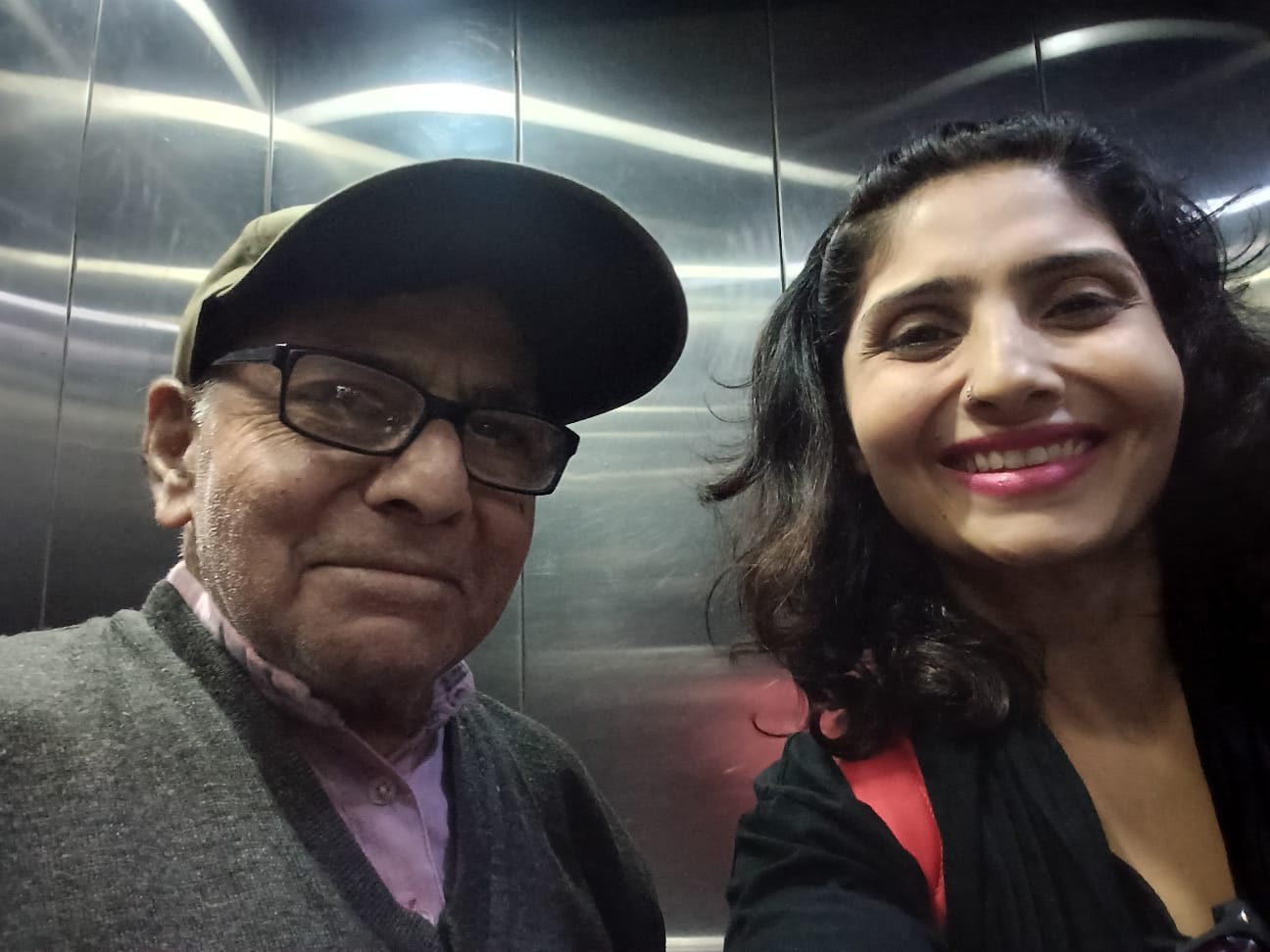A selfie with Prof. Gupta in a winter cap, in an elevator.